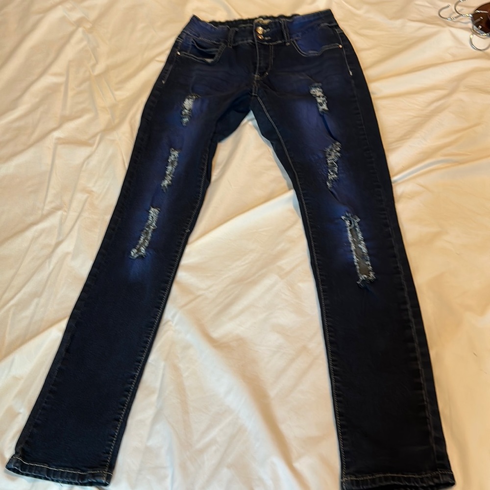 Size 11 blue jeans with cuts in the thigh area
